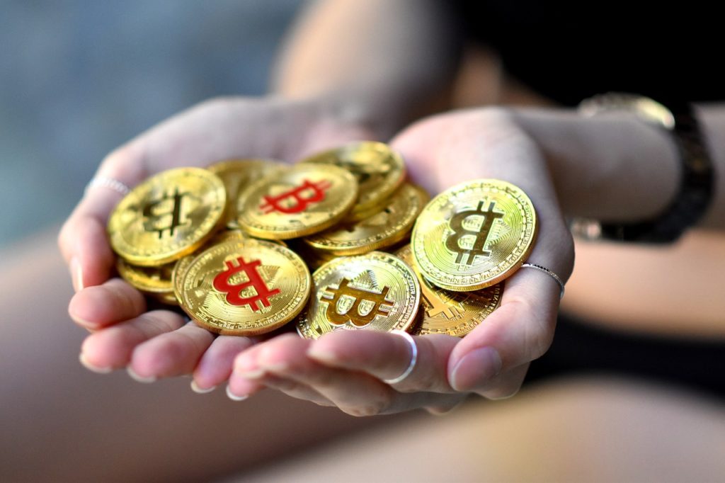 bitcoin-coins-handful-wallet